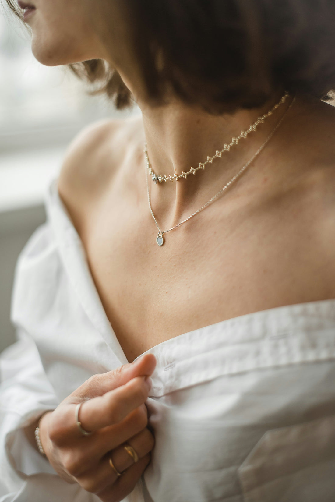 Meaningful jewelry and symbolic pendants representing personal style trends in 2026