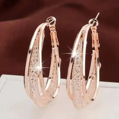 Elegant RozGold Crystal Hoop Earrings with a Twisted Metal Design