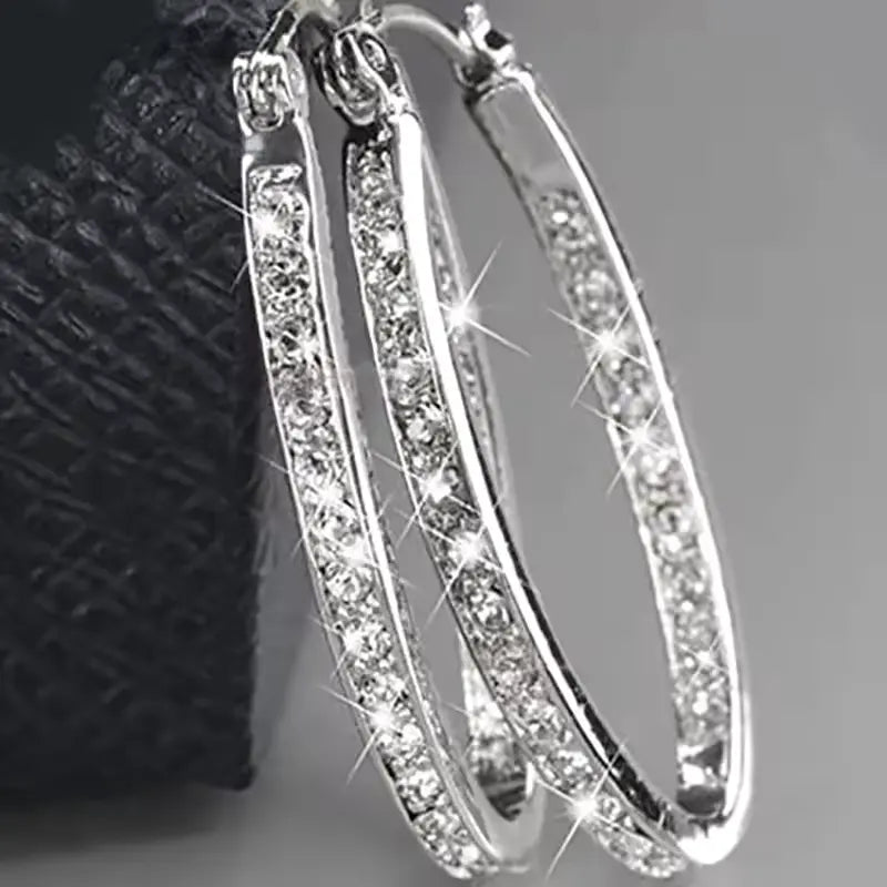 silver hoop earrings with sparkling rhinestone details