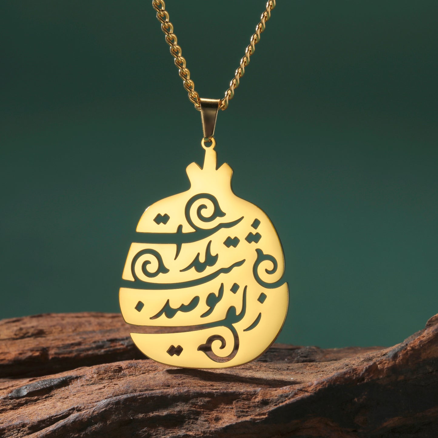 Woman wearing Yalda Persian calligraphy necklace with stainless steel poem pendant.