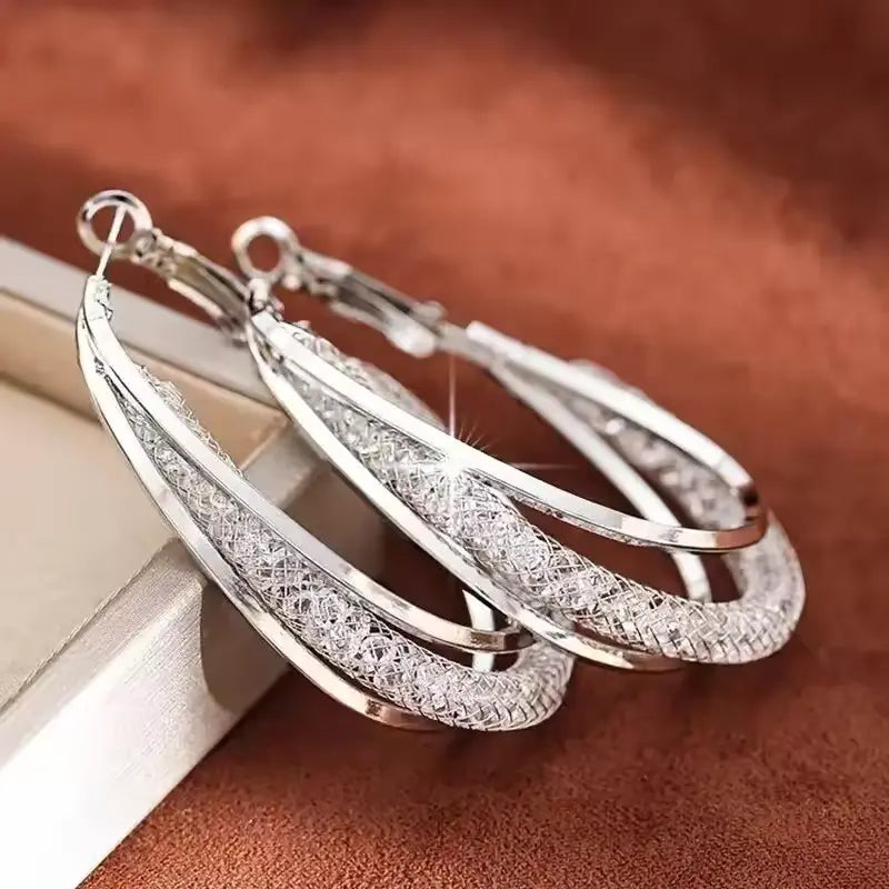 Stylish  silver Hoop Earrings with Crystal Accents and Twisted Design